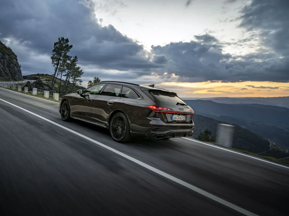 Audi A6 Avant at sunset, on a mountain road