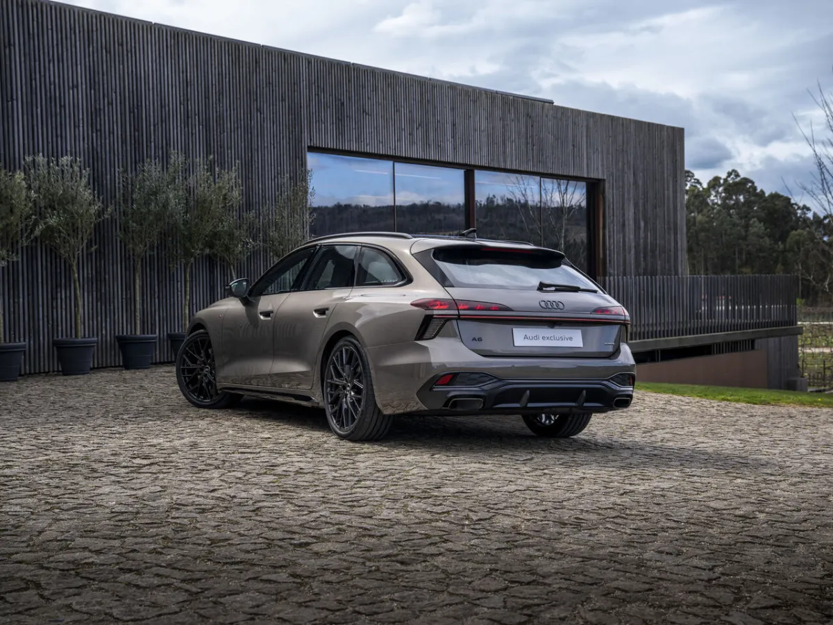 Audi A6 Avant in front of a modern building