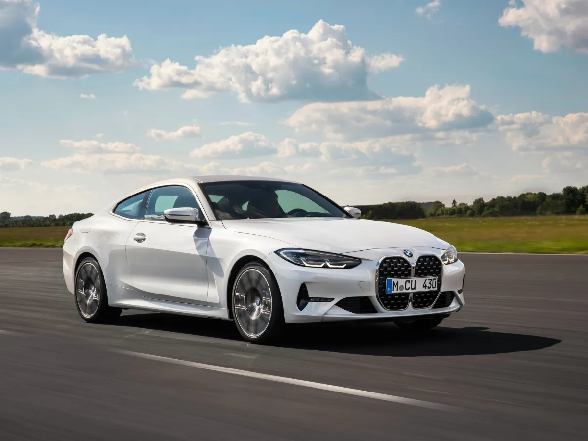 BMW 4 Series Coupé in white, on the track
