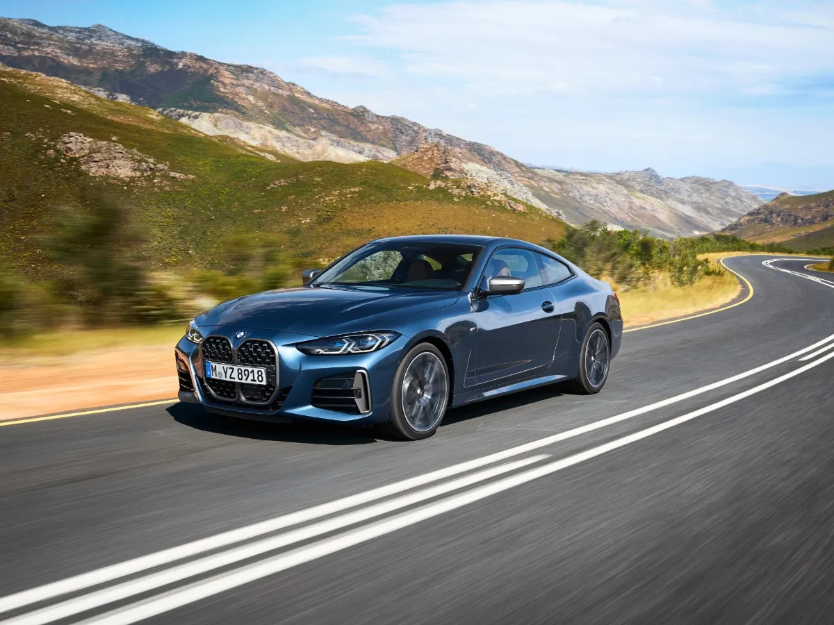 BMW 4 Series Coupé in blue, on a mountain road