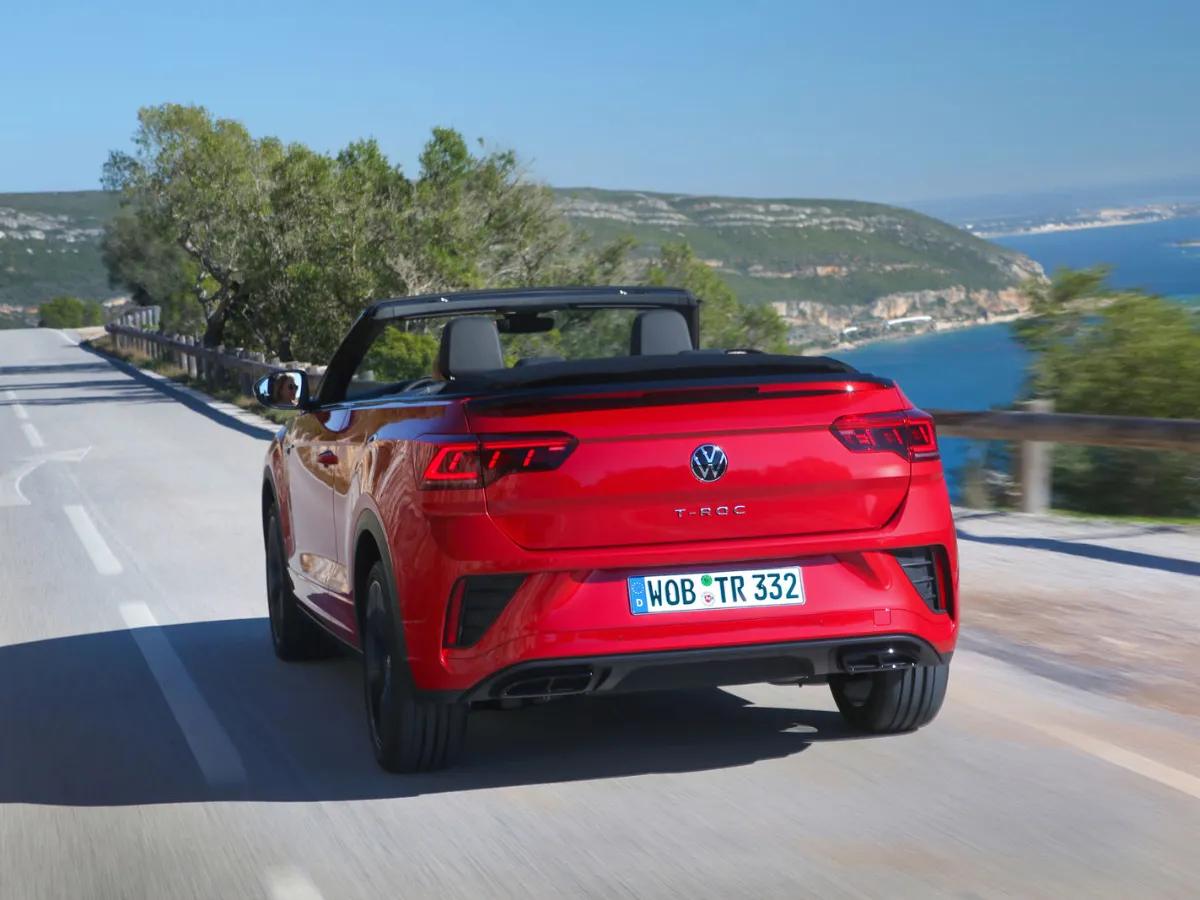 Volkswagen T-Roc Cabrio from the rear, on a coastal road